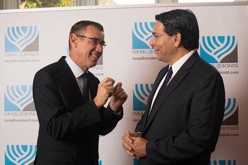 Ambassadors Mark Regev (left) and Danny Danon enjoy a mini-diplomatic summit during an Israel Bonds breakfast hosted by Ambassador Regev at his official London residence